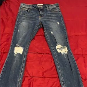 Distressed blue jeans